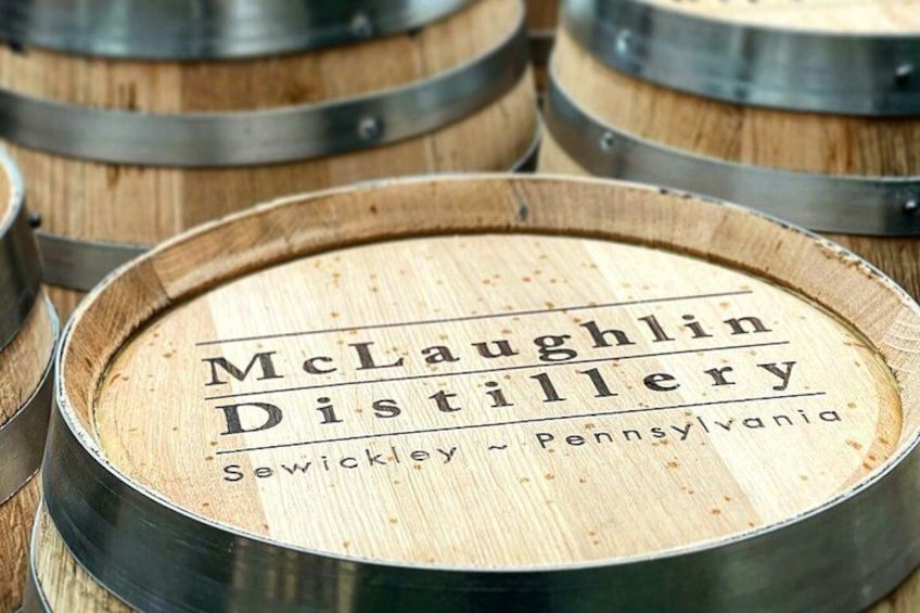 Wooden barrels with the text 'McLaughlin Distillery Sewickley - Pennsylvania' on them. 4