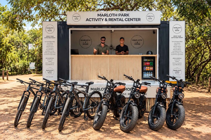 A Marlow Park Activity & Rental Center with a signboard listing activities and rentals, and several bicycles parked in front. 1