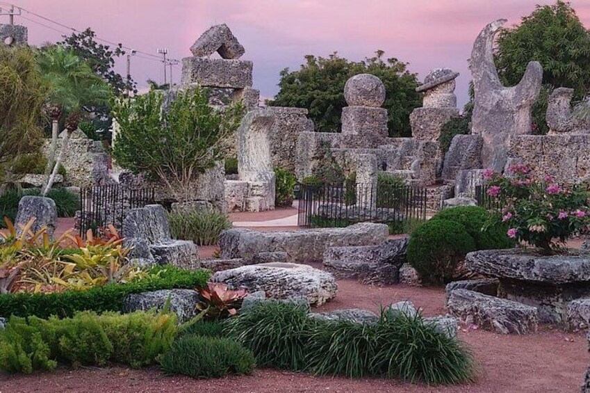 A cemetery with stone headstones and a pathway. 2