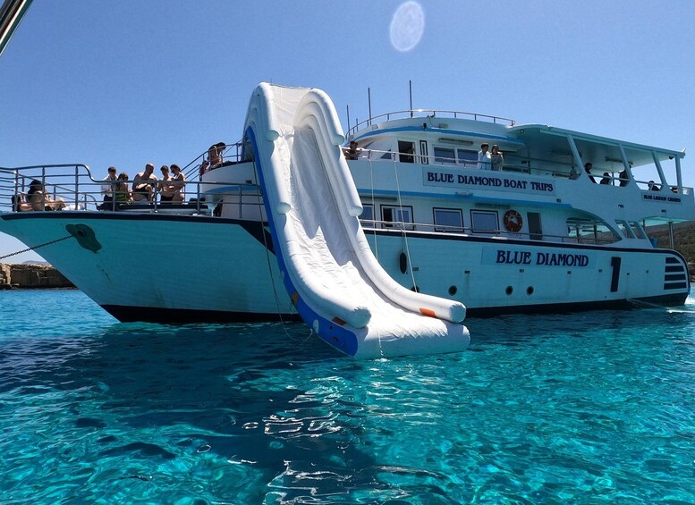 A boat named Blue Diamond with a water slide. 5