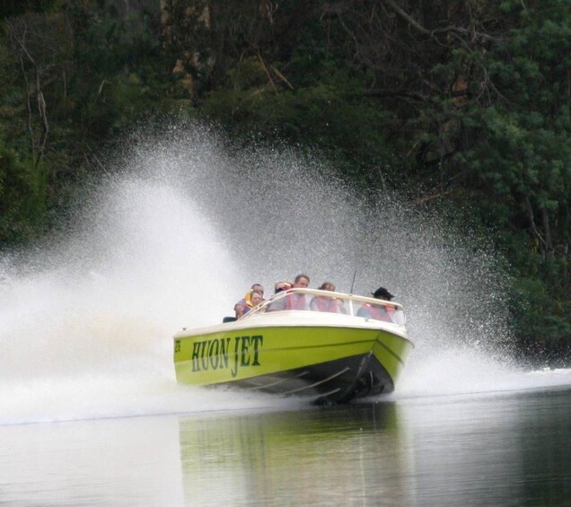A speedboat with the name 'Hoon Jet' moving through water, creating a large spray. 5