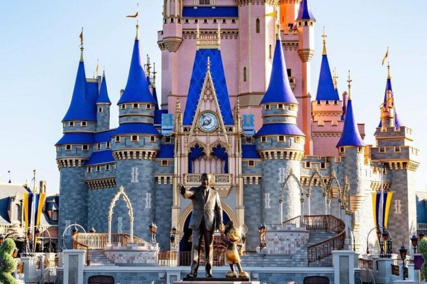A castle with blue spires and a clock tower. 2