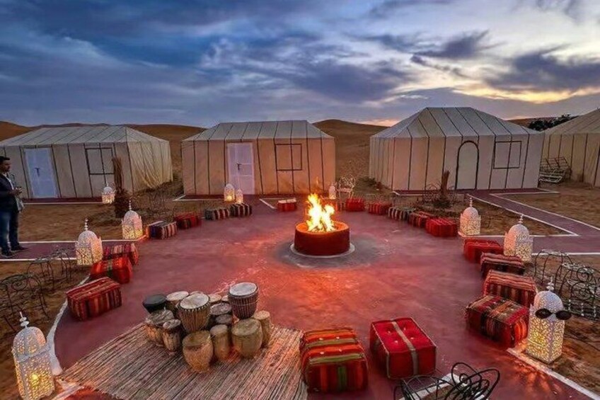 Yurts, a central fire pit, and traditional decor. 1