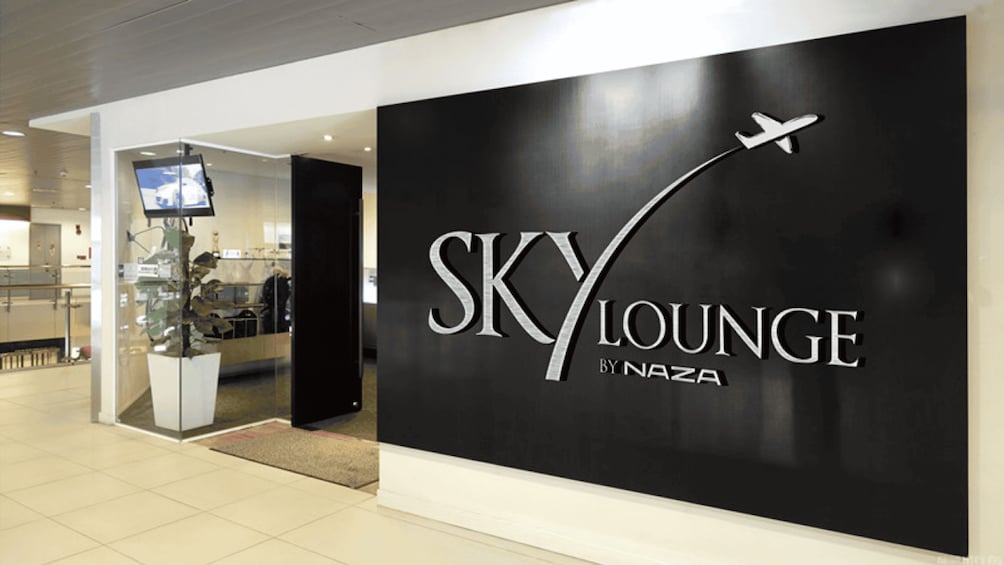 A SKYLOUNGE sign with an airplane graphic. 2