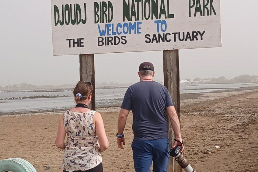A sign for Djoudj Bird National Park welcoming visitors to the sanctuary. 1