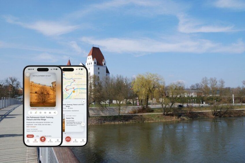 A smartphone displaying a map and a scenic view of a river with a castle in the background. 1