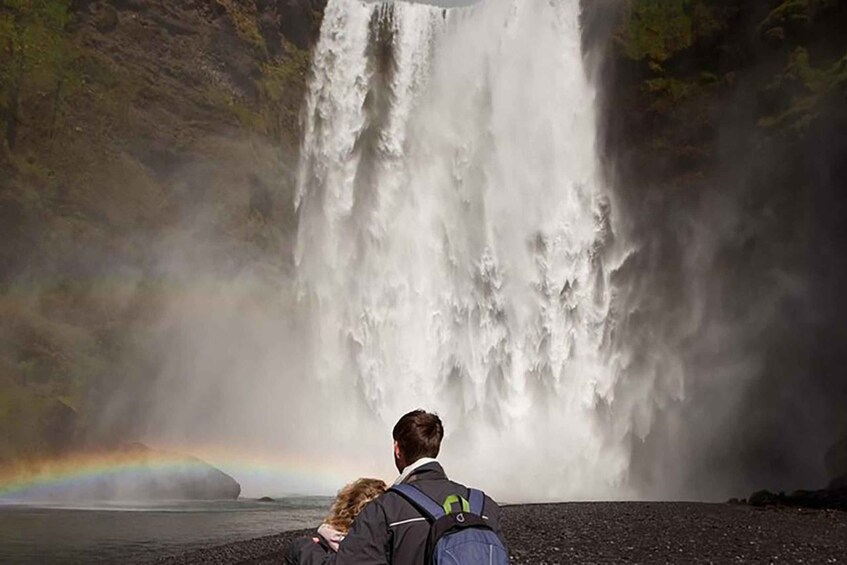 A waterfall with a rainbow in the background. 3
