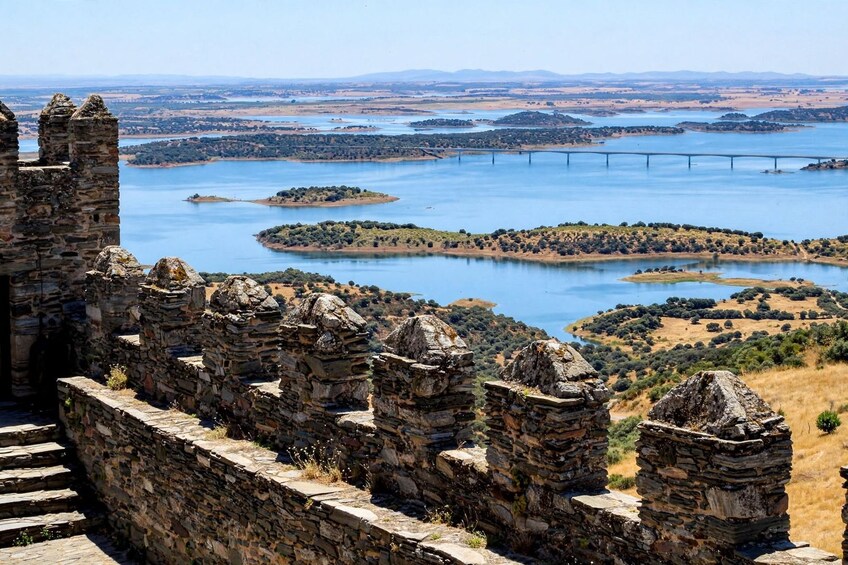 Ancient stone ruins, a river, and a bridge. 4