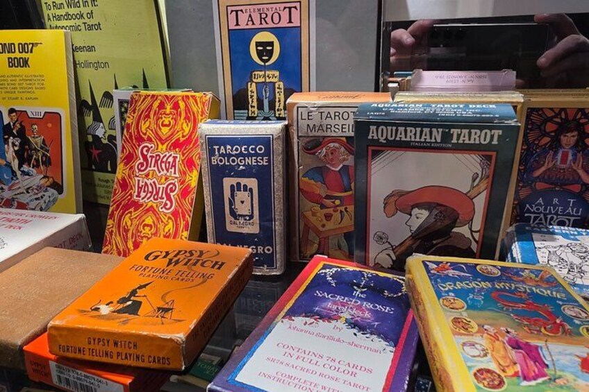 A collection of tarot card boxes and books. 2