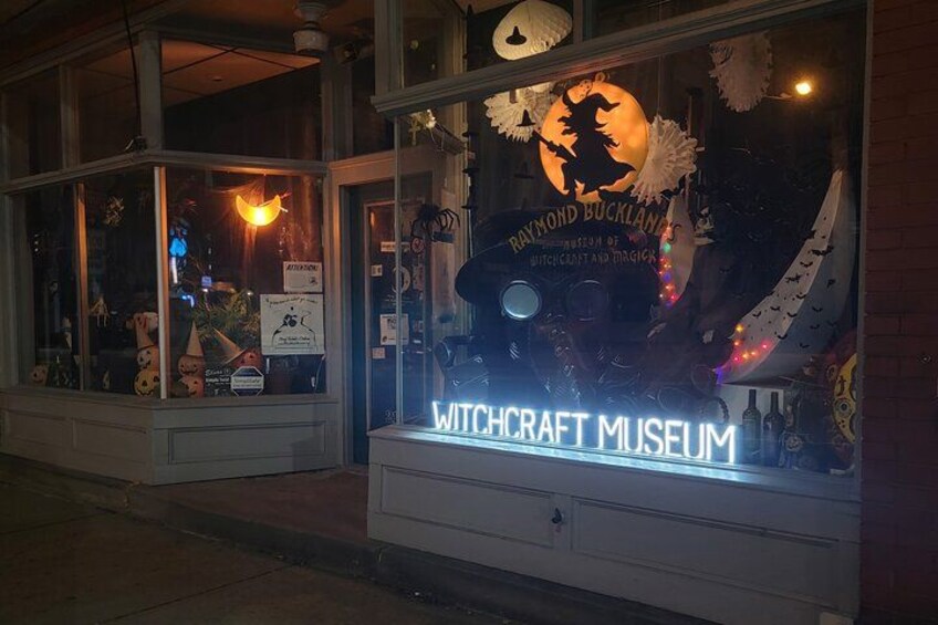The exterior of the Witchcraft Museum with illuminated signage and decorative elements. 5