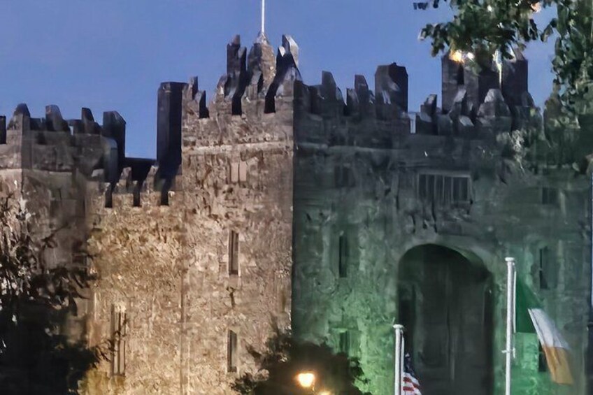 A castle with a large arched entrance and battlements. 3