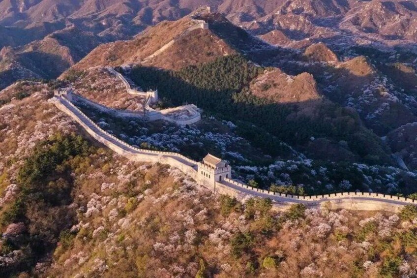 The Great Wall of China winding through mountainous terrain. 2