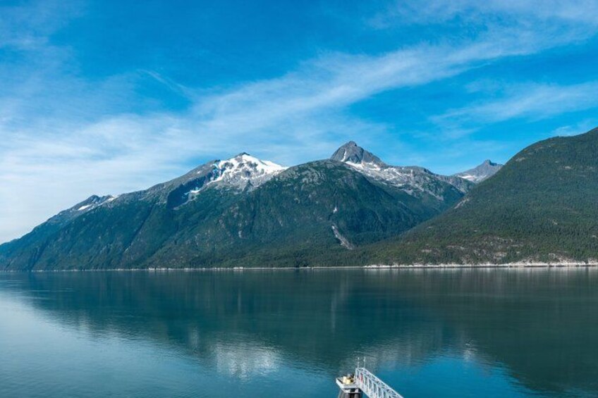 A calm lake with mountains in the background. 3