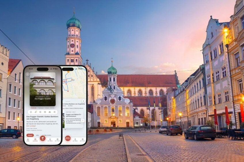 A cobblestone street with historic buildings, a church with a green dome, and a smartphone displaying a map. 1