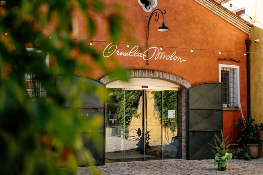 A building with a sign that reads 'Ornella Moton.' 3