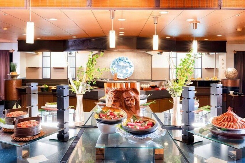 A restaurant interior with a glass dining table, various dishes, and decorative elements. 2
