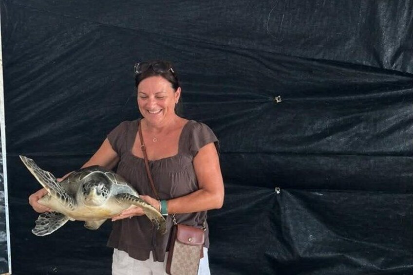 A person holding a fish. 2