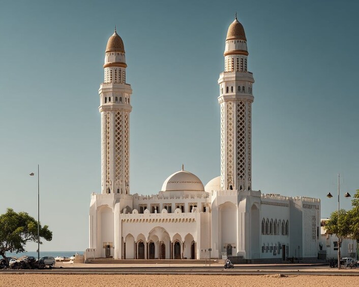 A large mosque with two tall minarets and a dome. 5