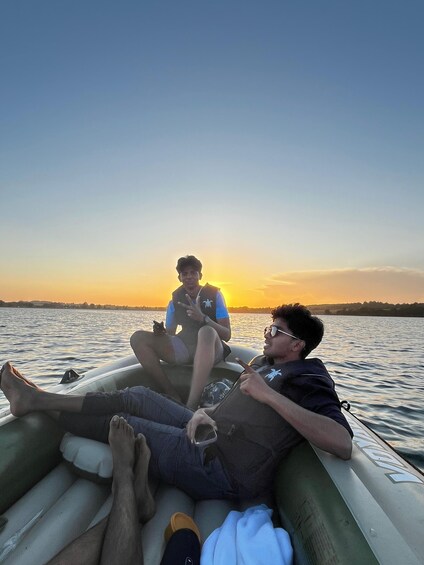 Two people on a boat at sunset. 2