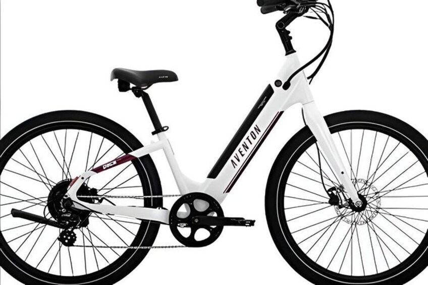 A white bicycle with the brand name 'VENTON' on the frame. 2