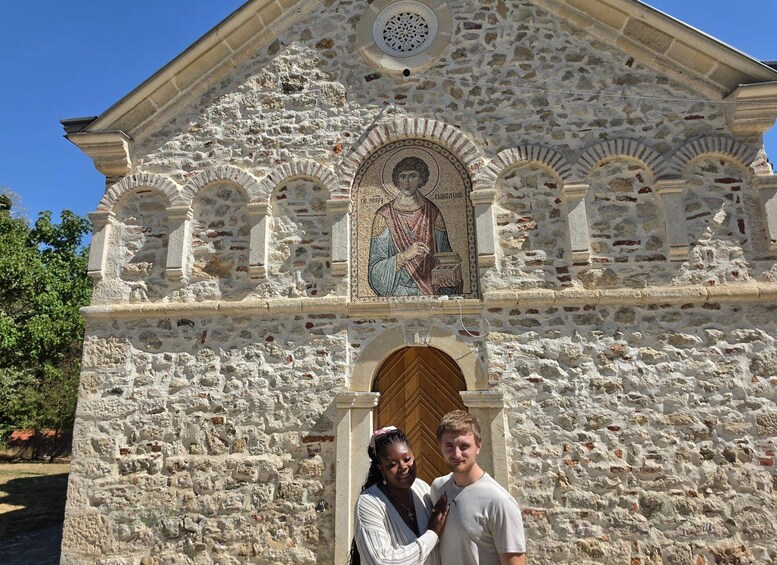 A stone church with a mosaic of a religious figure above the entrance. 4