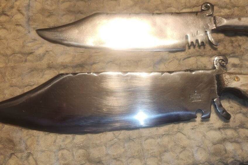 Two knives with serrated edges and a textured handle. 4