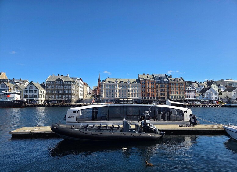 A harbor with a ferry docked at a pier, surrounded by historic buildings. 5