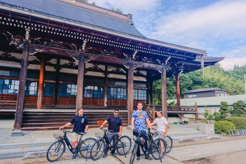A traditional Japanese building with a wooden structure and a tiled roof. 2