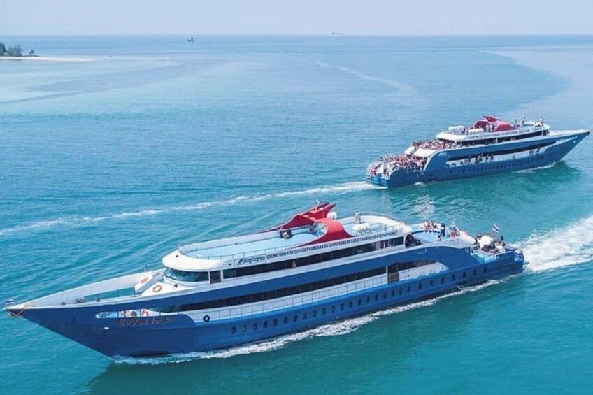 Two large blue cruise ships on the ocean. 1