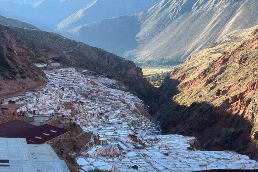 A valley with terraced fields and a river. 2