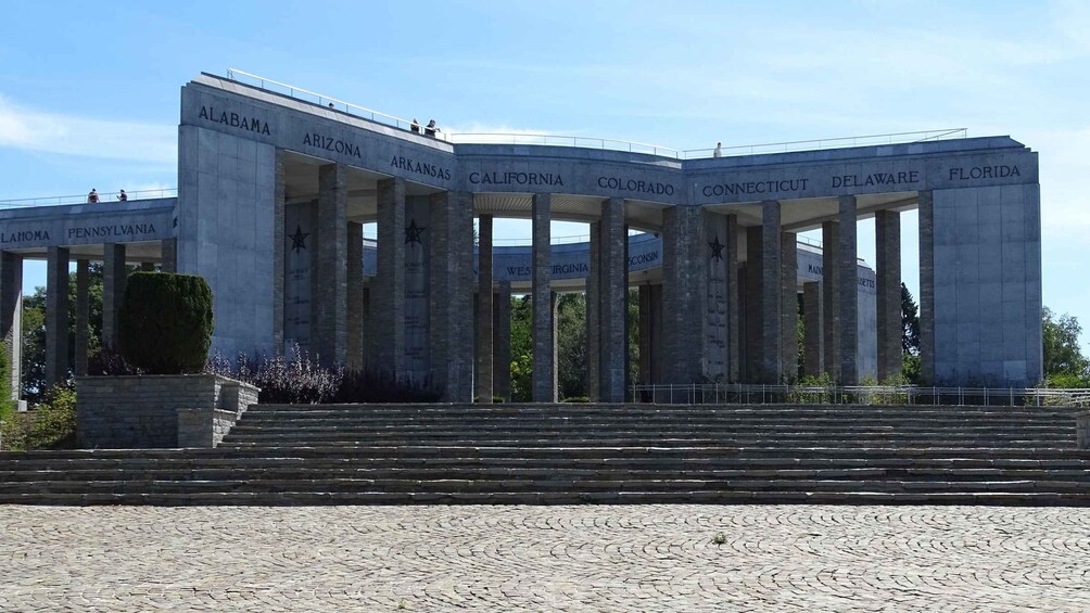 A large building with multiple columns, each labeled with a U.S. state's name. 4