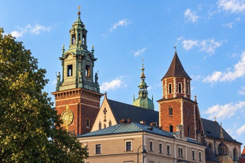 A historic building with a clock tower and a dome. 5