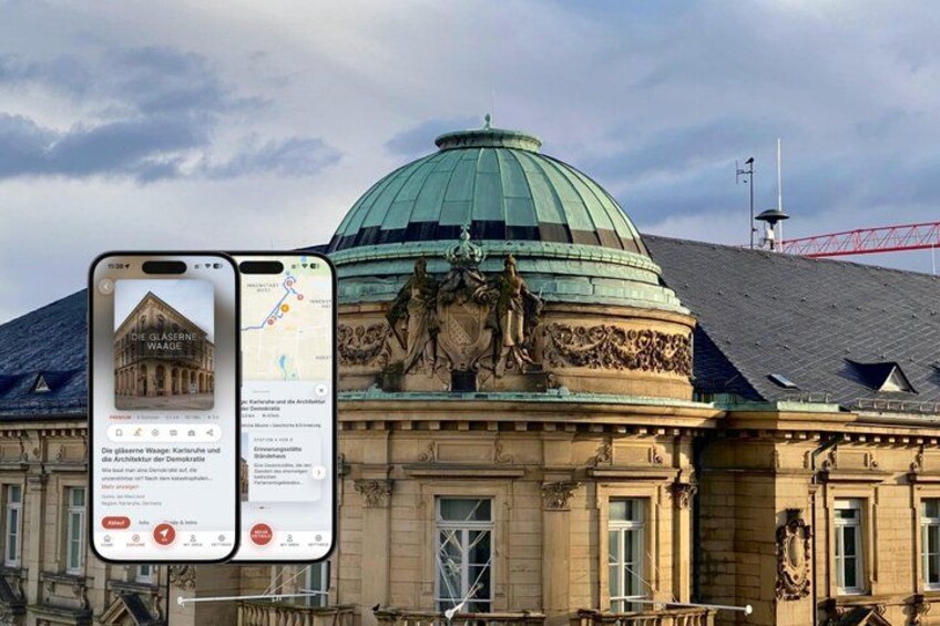 A historic building with a dome and a statue on the roof. 1