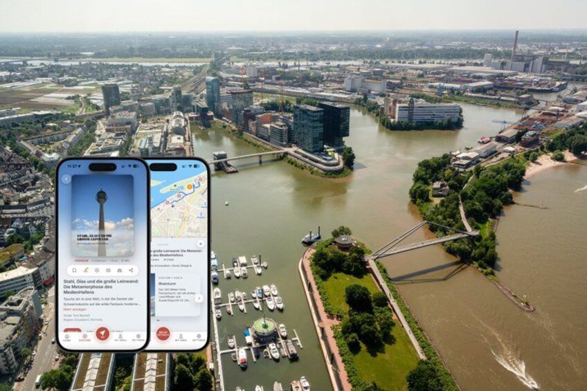 A river with boats, a bridge, and a cityscape with buildings. 1