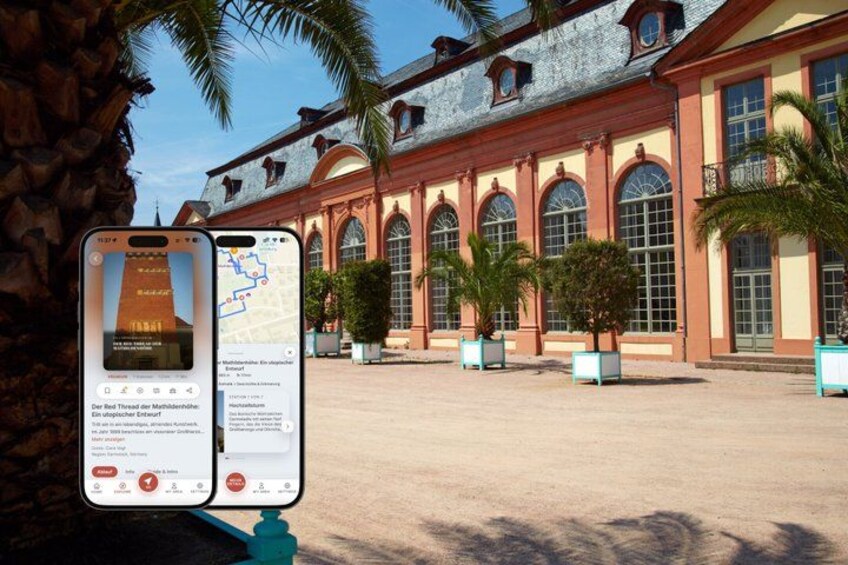 A historic building with arched windows and a tiled roof, surrounded by palm trees and potted plants. 1