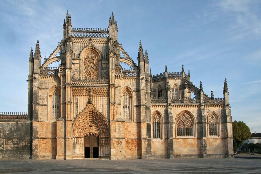 A large Gothic cathedral with intricate stonework and pointed arches. 1