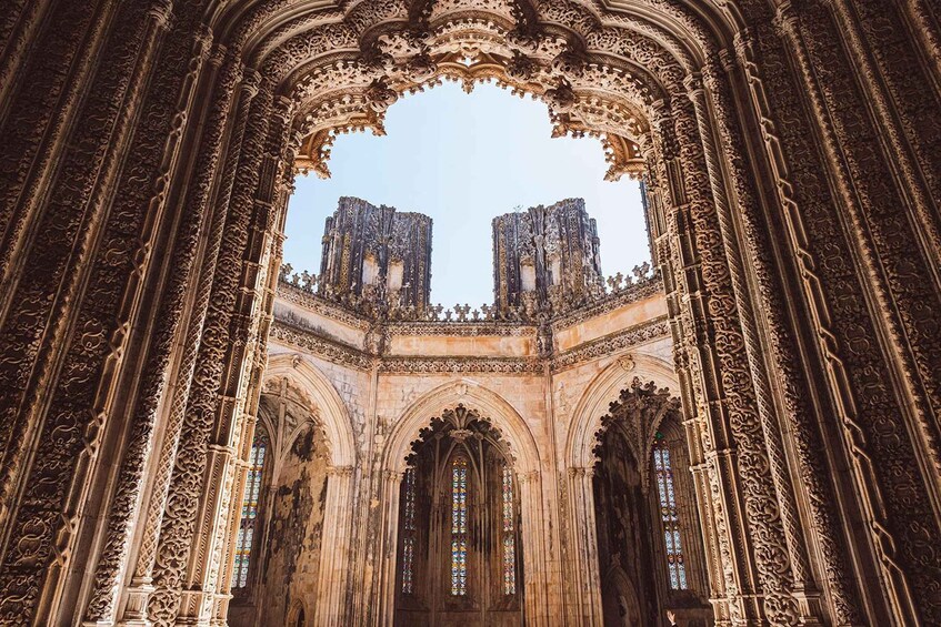 A Gothic cathedral interior with ornate arches and stained glass windows. 4