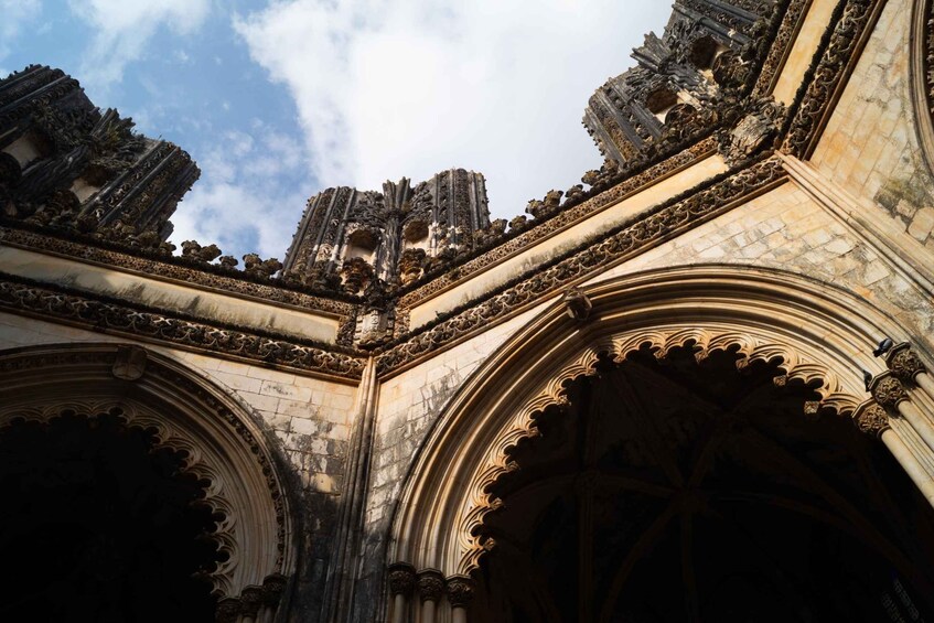 An ornate Gothic-style cathedral interior with intricate stone carvings and pointed arches. 5