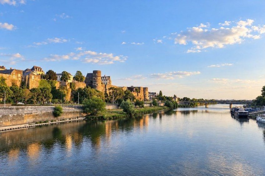 A river with a castle and a bridge. 3