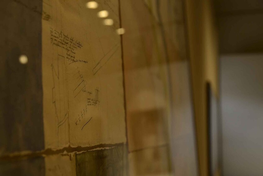 A wall with handwritten notes and diagrams. 4