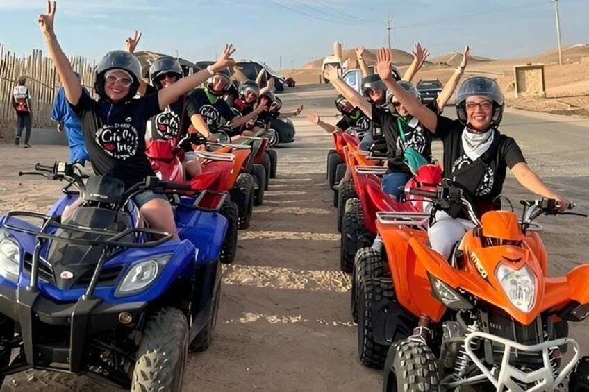 People on ATVs in a desert setting. 4