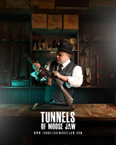 A person playing a guitar in a dimly lit room with shelves of vintage items. 2