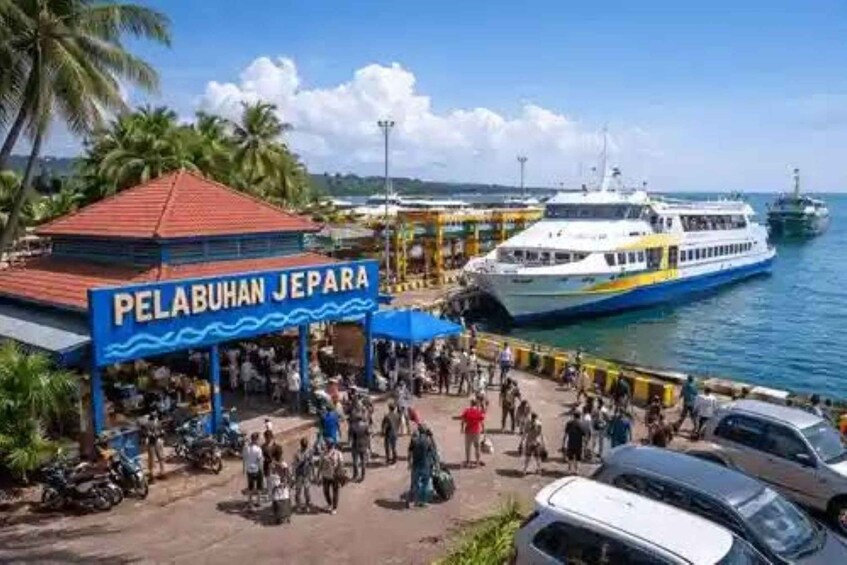 A ferry terminal with a sign reading 'PELABUHAN JEPARA' and a large ferry docked at the pier. 4