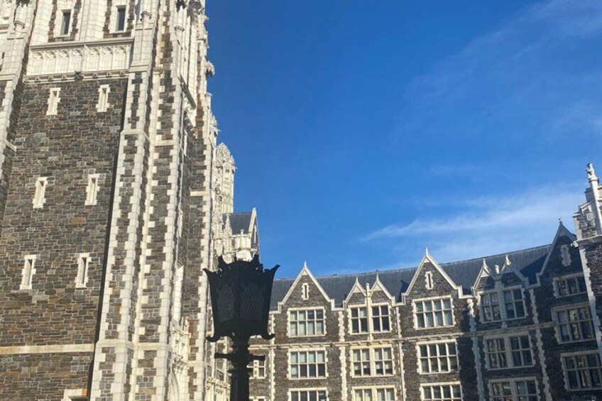 A historic building with intricate stonework and multiple gabled roofs. 4