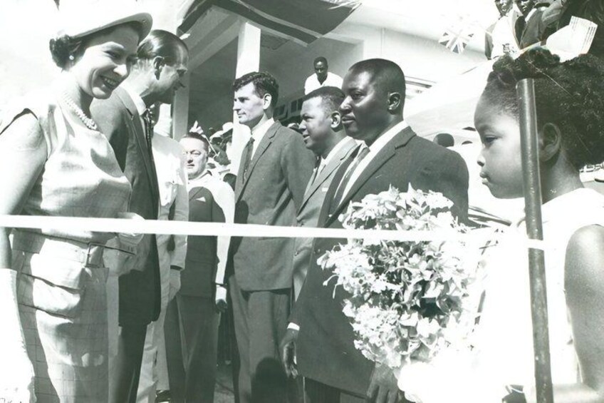 A group of people standing at a ribbon-cutting ceremony. 3