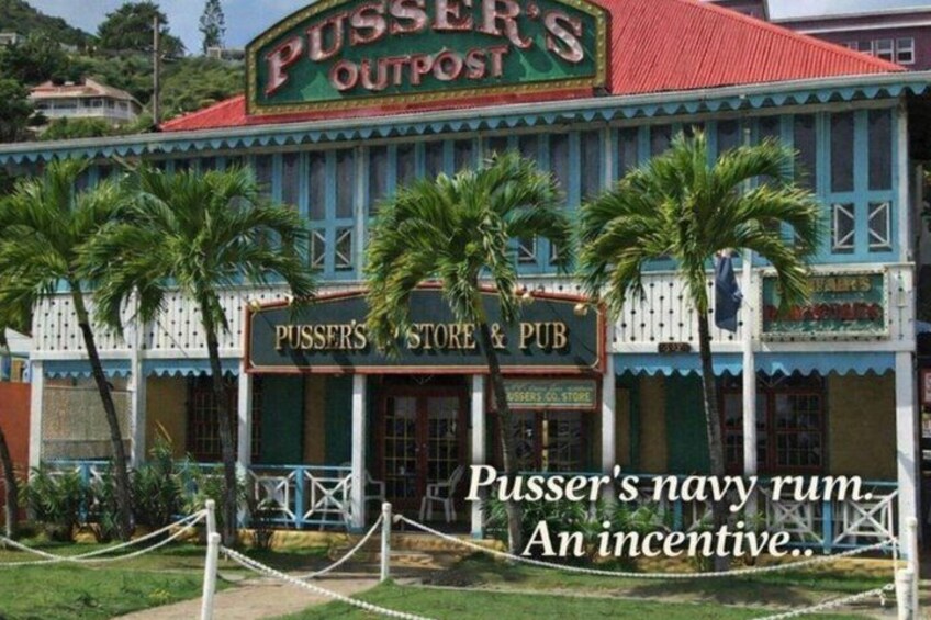 A building with a sign that reads 'Pusser's Outpost Store & Pub.' 5