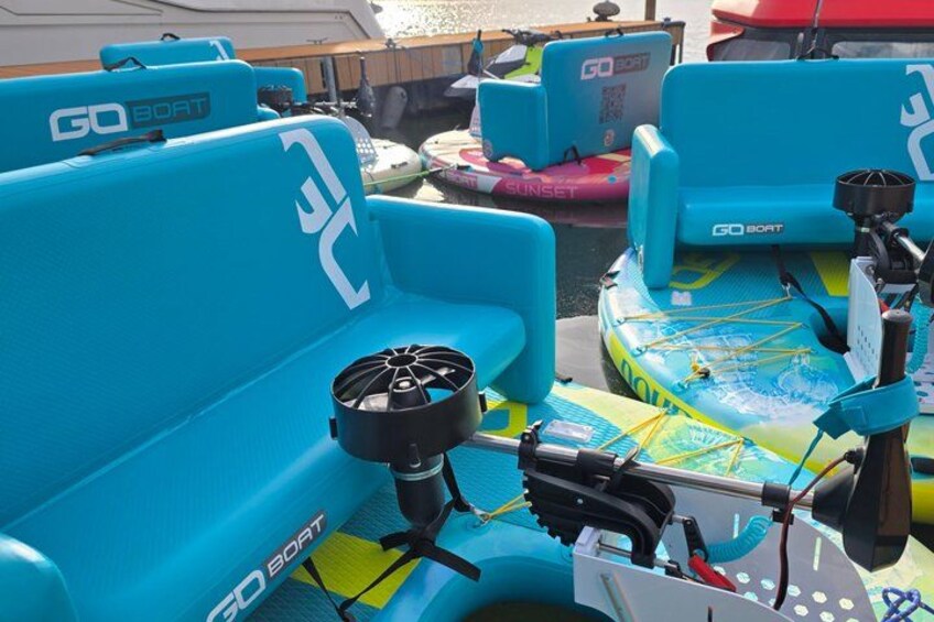 A row of blue Go Boat pontoons with a fan and a yellow and blue map. 5