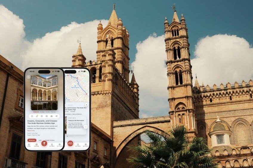 A historic building with two prominent towers and a palm tree in the foreground. 1