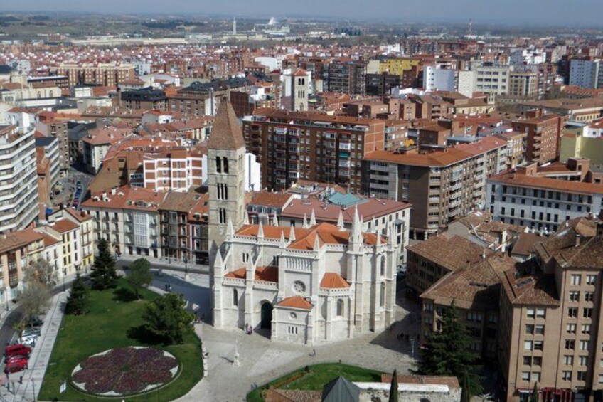 A cityscape with a prominent cathedral, surrounded by residential and commercial buildings. 5