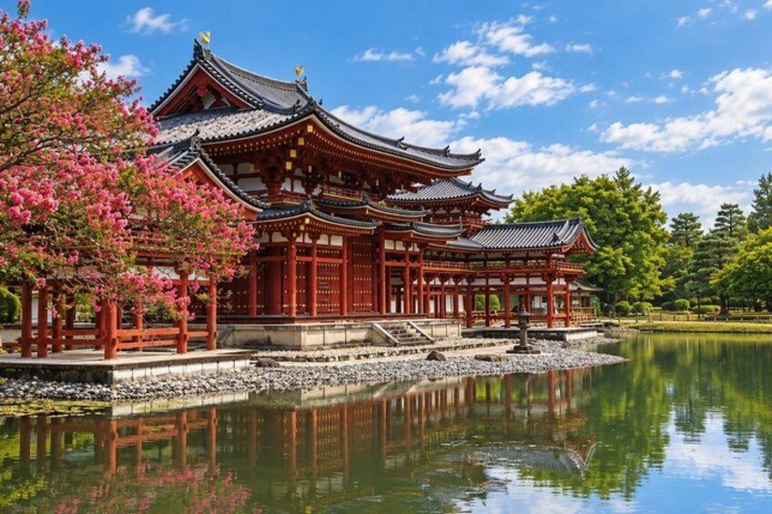 A traditional Japanese temple with a reflection in the water, surrounded by cherry blossoms and a clear sky. 4